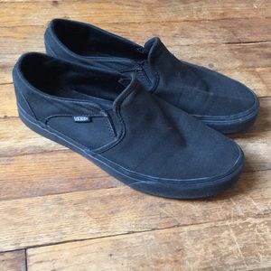 All black slip on vans